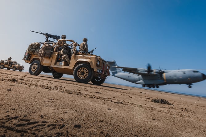 See SWNS story SWNAbeach. How's this for a day at the beach? Huge military transport planes have been spotted landing on Pembrey Sands in West Wales. The RAF Atlas A400Ms have been carrying out beach landing training at the coastal spot this week. They also practiced the insertion of so-called pathfinders, specialised soldiers dropped into place in order to set up and operate drop zones. Incredible pictures show the crews of the Brize Norton-based LXX and 30 Squadrons carrying out the objectives.