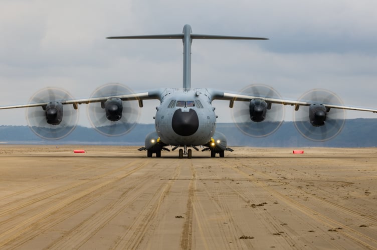 See SWNS story SWNAbeach. How's this for a day at the beach? Huge military transport planes have been spotted landing on Pembrey Sands in West Wales. The RAF Atlas A400Ms have been carrying out beach landing training at the coastal spot this week. They also practiced the insertion of so-called pathfinders, specialised soldiers dropped into place in order to set up and operate drop zones. Incredible pictures show the crews of the Brize Norton-based LXX and 30 Squadrons carrying out the objectives.