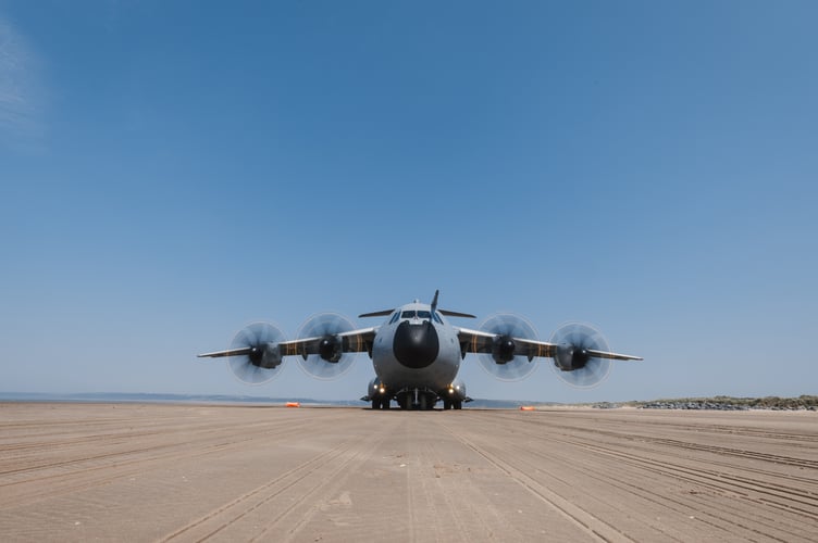 See SWNS story SWNAbeach. How's this for a day at the beach? Huge military transport planes have been spotted landing on Pembrey Sands in West Wales. The RAF Atlas A400Ms have been carrying out beach landing training at the coastal spot this week. They also practiced the insertion of so-called pathfinders, specialised soldiers dropped into place in order to set up and operate drop zones. Incredible pictures show the crews of the Brize Norton-based LXX and 30 Squadrons carrying out the objectives.