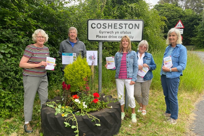 Residents and organiser Jane Mason (left) presented Prue Barlow (right) with a newly printed Cosheston Charity Open Gardens programme.